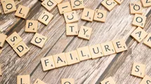 Scrabble game with failure word on a table.