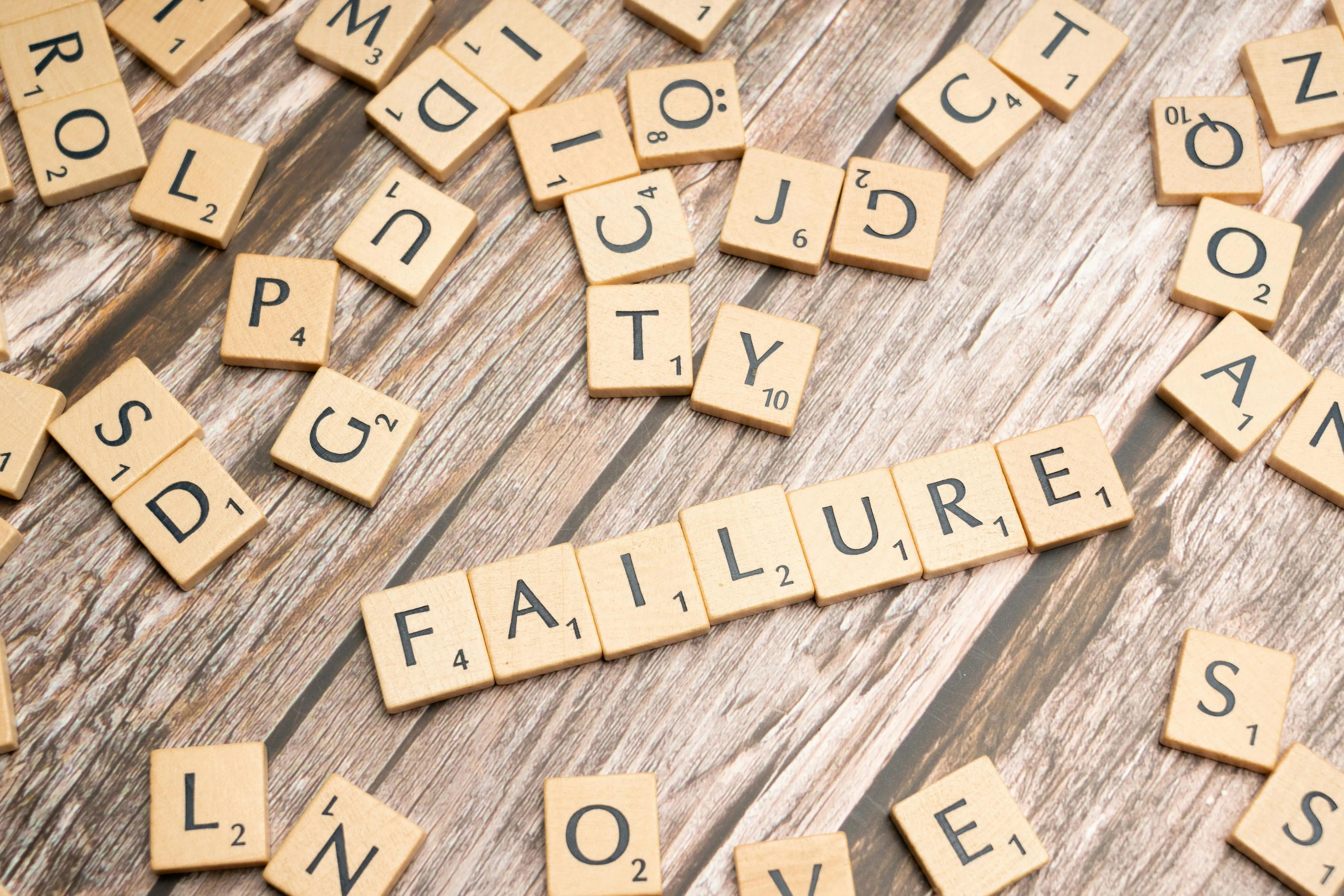 Scrabble game with failure word on a table.