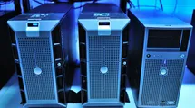 A photo of there desktop computers in a data center rack shelf.